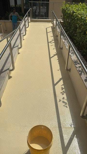 Final epoxy top coat at the Al Zeina pool ramp