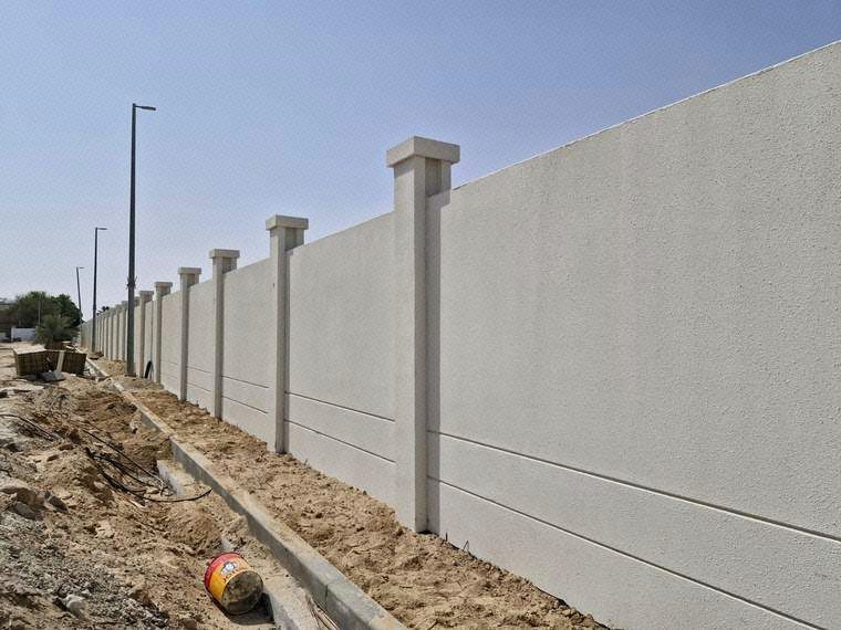 Application of first coat exterior paint finish on boundary wall