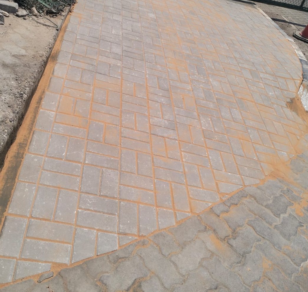 Interlock paving reinstated to the approved pattern around the new foundations