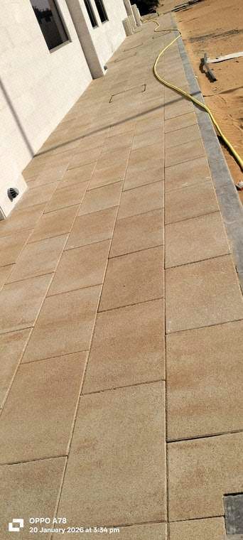 Interlock tile laying in progress