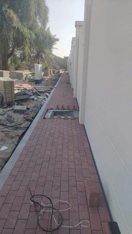 Installation of PASCO interlock tiles in progress (External)