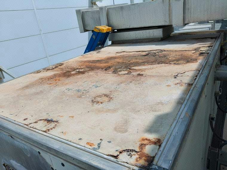 Initial Site Condition – AHU Roof with Extensive Corrosion
