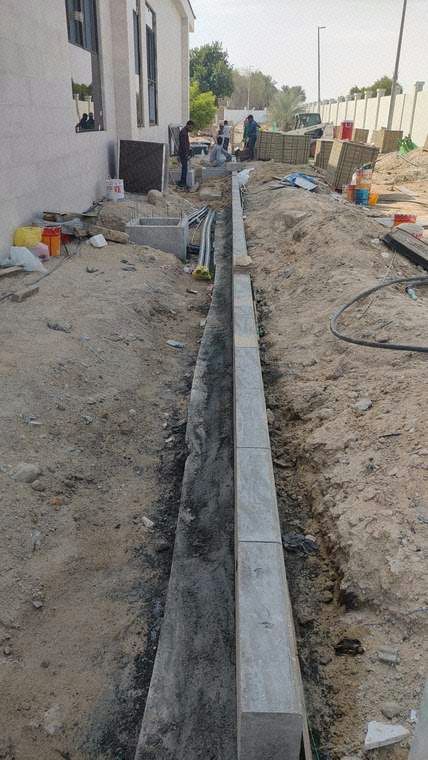 Installation of kerbstones over PCC foundation